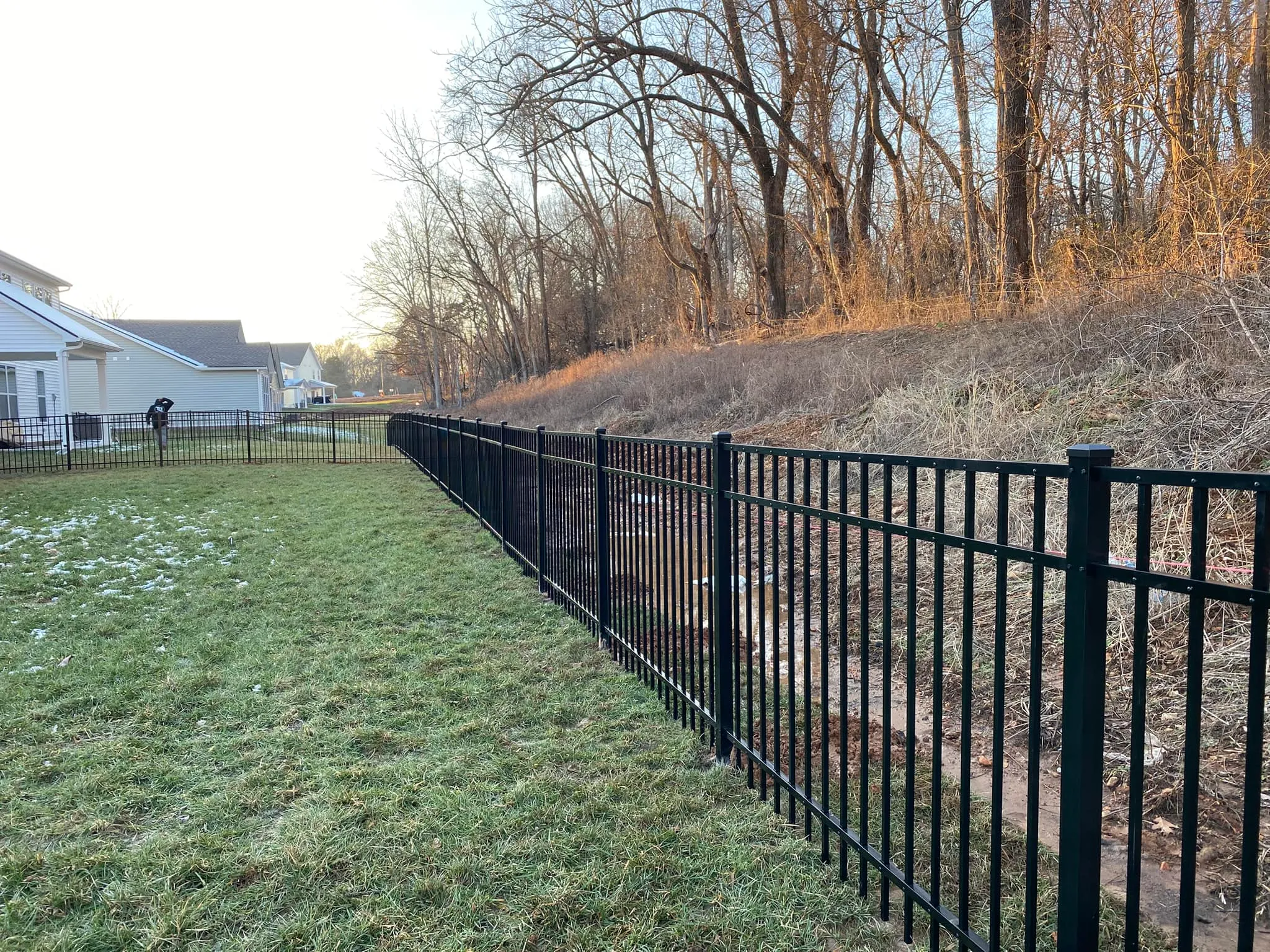 Black aluminum boundary fence in Clarksville