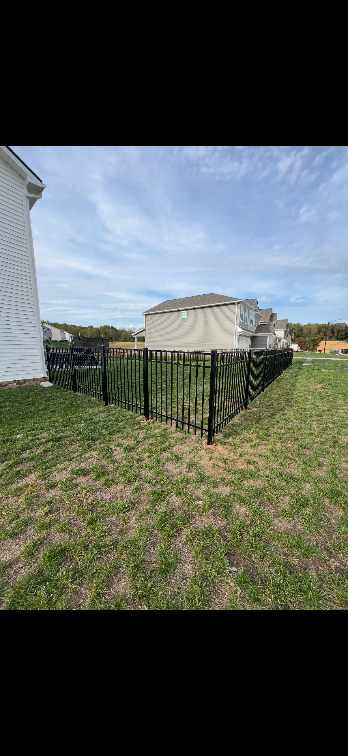 Sleek black aluminum fencing for modern property security.