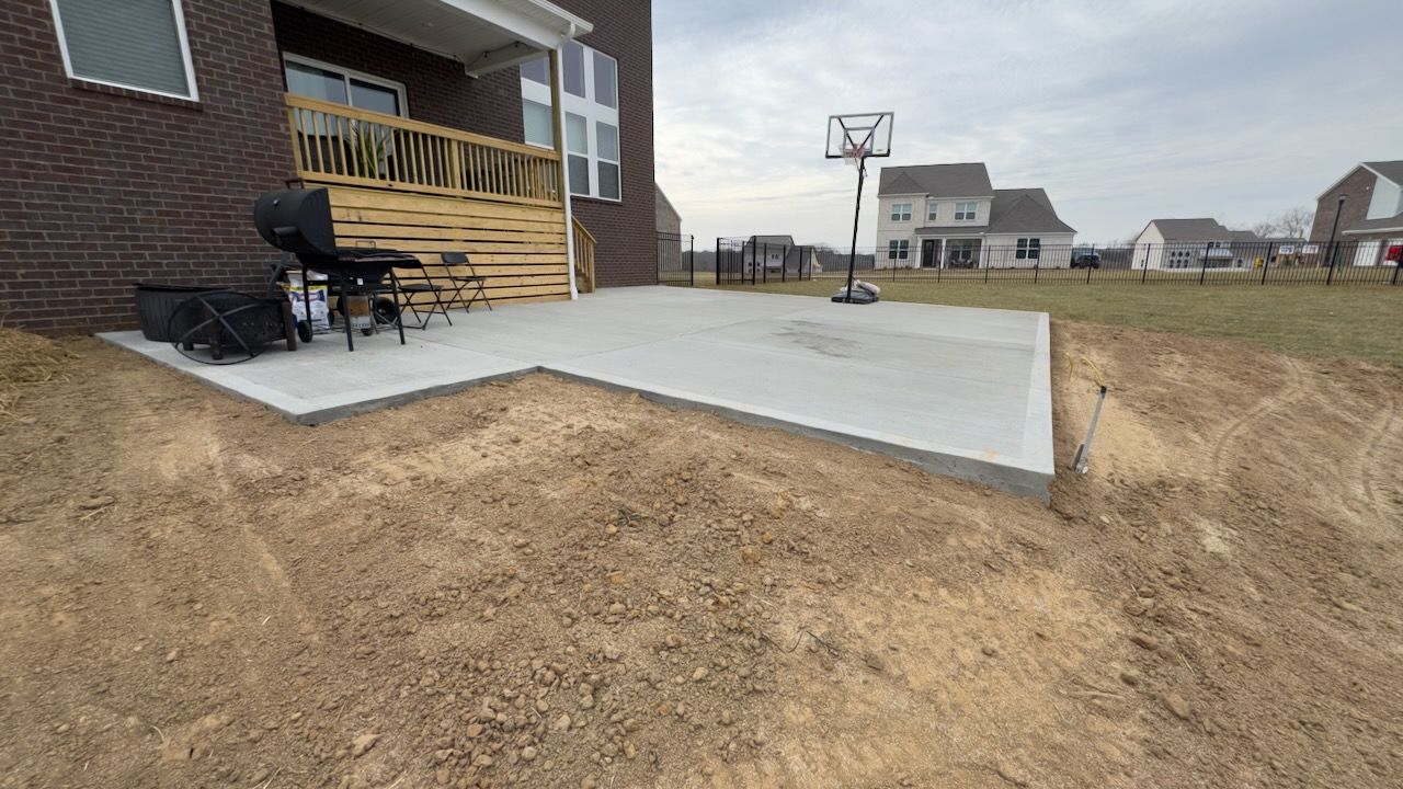 Seamless concrete patio extension to maximize backyard space.